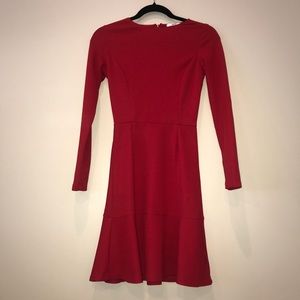 Red long sleeve fit and flare dress.